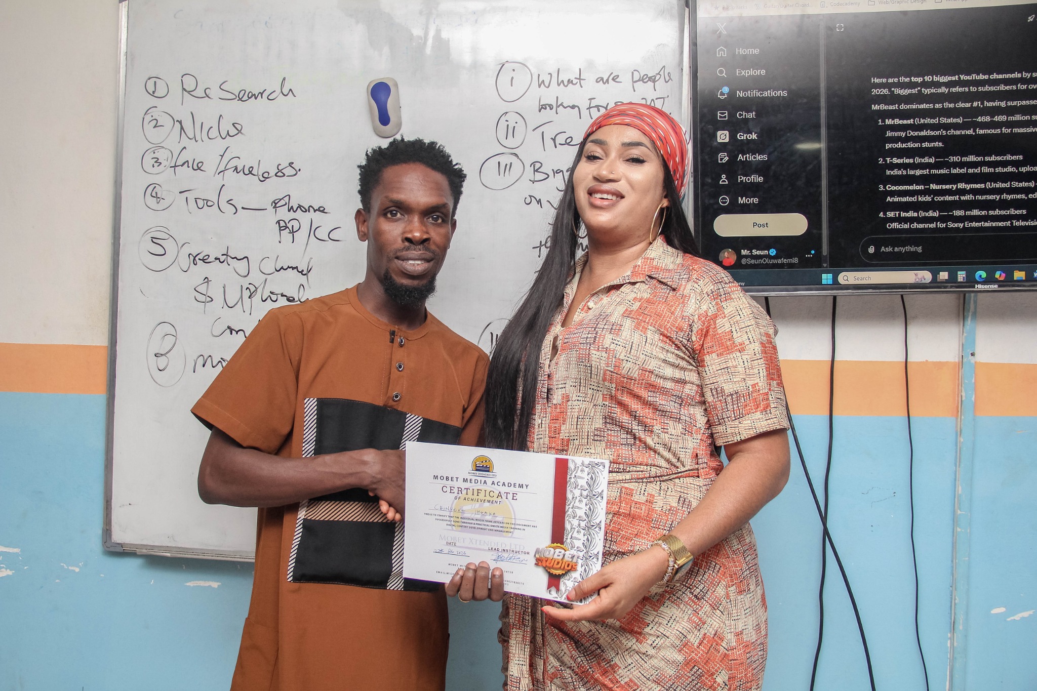 Mobet Media Academy participant receiving certificate